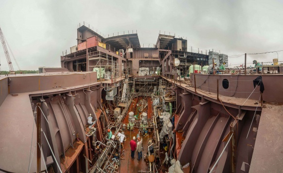 Workers constructing one of Pasha Hawaii's Shipping Container vessels, the MV Marjorie C.